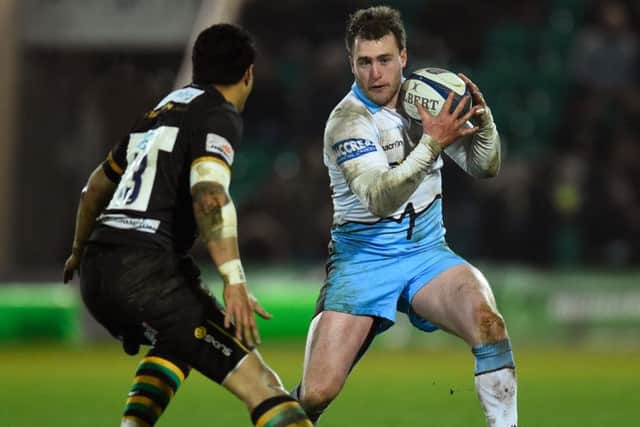 Stuart Hogg challenged by George Pisi of Northampton Saints during the European Rugby Champions Cup match. Picture: Getty