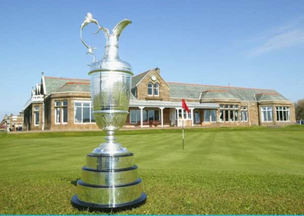 The Open's Claret Jug displayed at St Andrews 18th hole