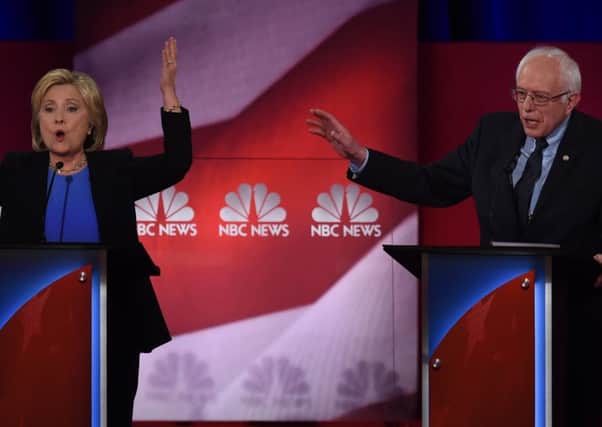 Hillary Clinton  and Bernie Sanders participate in the NBC News television debate. Picture: AFP/Getty Images
