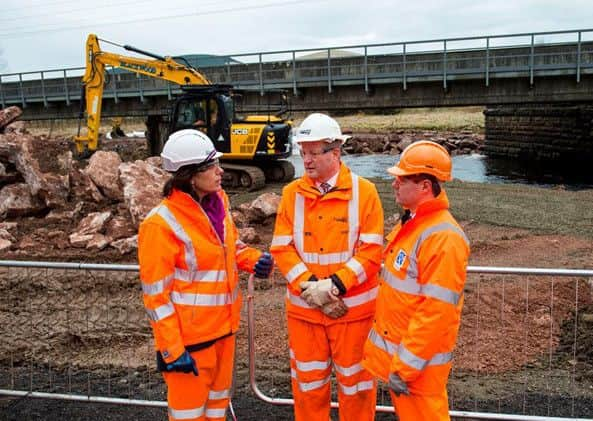 Rail Minister Claire Perry and Scottish transport secretary Derek Mackay survey storm damage at Lamington viaduct. Picture: Contributed