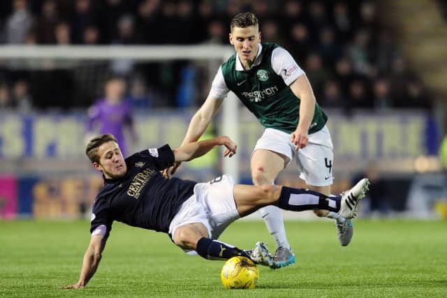 Will Vaulks and Paul Hanlon battle for possession during the 1-1 draw at the Falkirk Stadium. Picture: Michael Gillen