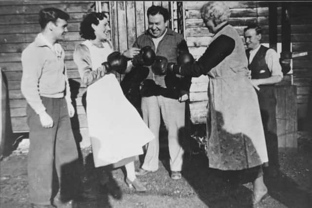 Benny Lynch (left) takes a break from training in Campsie Glen with friends and family