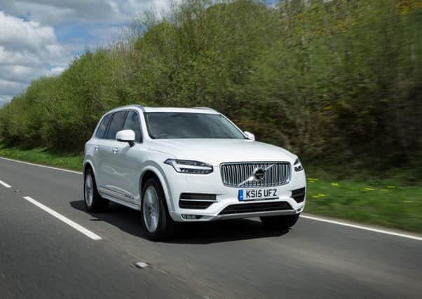 Front, dynamic image of the all-new Volvo XC90 in Ice White