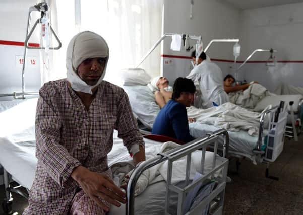 A wounded member of Tolo TVs staff is treated in hospital in Kabul. At least seven people were killed and 25 wounded in the explosion. Picture: Getty