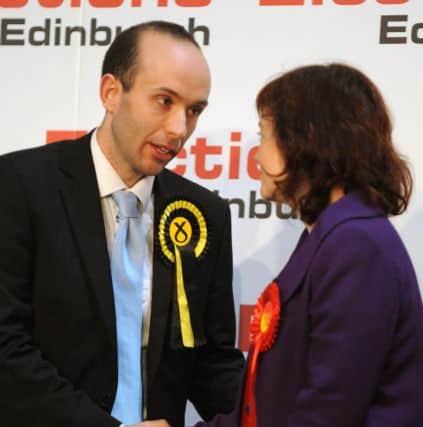 Marco Biagi of the SNP shakes hands with Labour's Sarah Boyack after winning the Edinburgh Central seat in 2011. Picture: Ian Rutherford