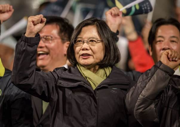 Tsai Ing-wen waves to supporters at DPP headquarters after her election victory. Picture: Getty