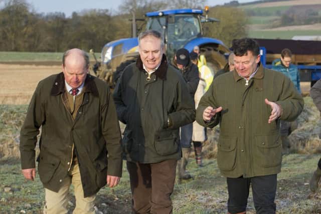 Allan Bowie, right, with rural affairs secretary Richard Lochhead, centre, and farmer Bob Strachan. Picture: Ian Rutherford
