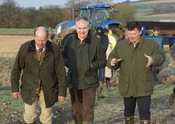Allan Bowie, right, with rural affairs secretary Richard Lochhead, centre, and farmer Bob Strachan. Picture: Ian Rutherford