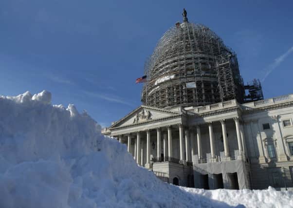 Snow piles up outside the US Capitol building in Washington as the city feels the chill. Picture: Getty