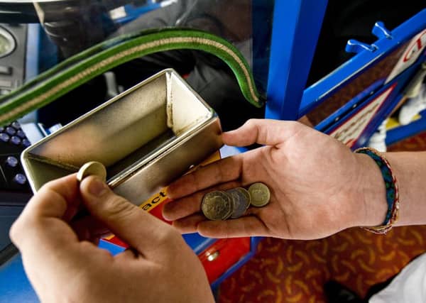 Trying to find the right change could become a thing of the past on the buses. Picture: Ian Georgeson