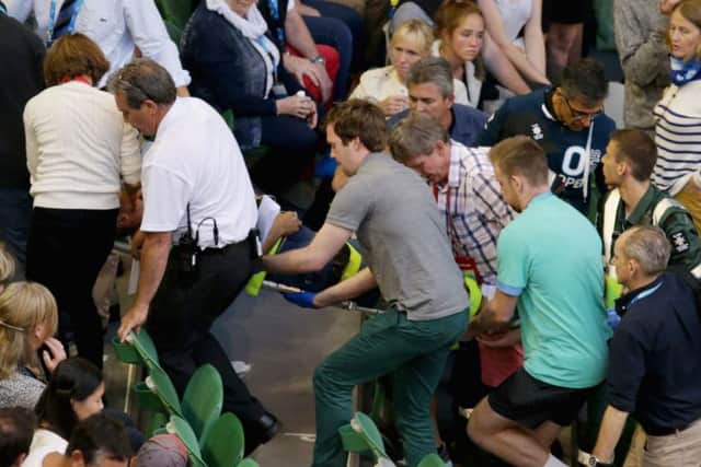 Nigel Sears, the coach of Ana Ivanovic, collapses during her third round at the Australian Open.  Picture: Darrian Traynor/Getty Images