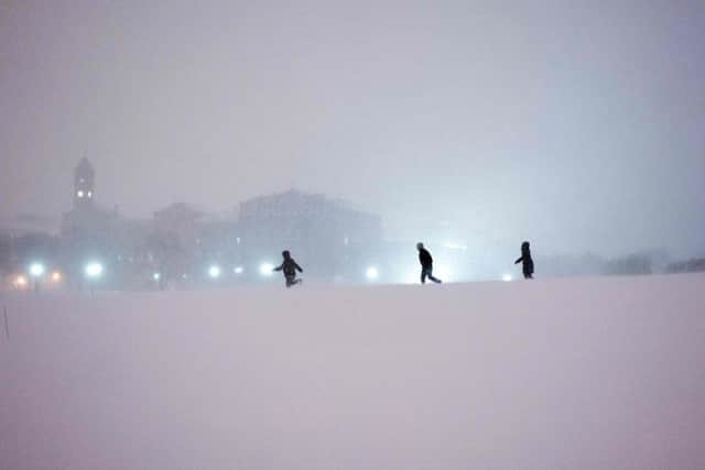 People play in the snow on the National Mall in Washington, DC.  Picture: Getty Images