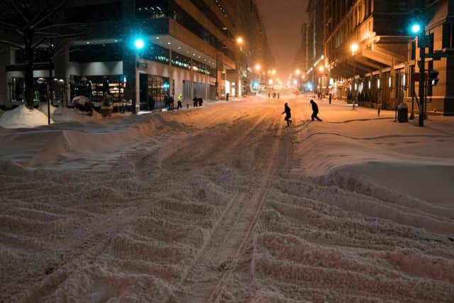 People cross the street in downtown Washington DC. Picture: AFP/Getty Images