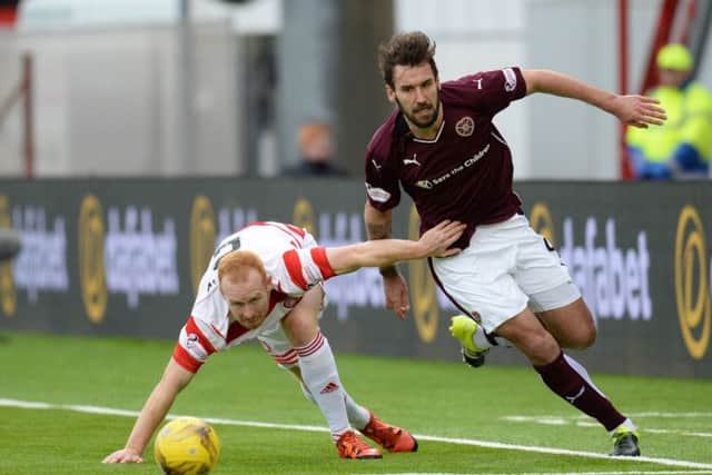 Blazej Augustyn challenges Ziggy Gordon for the ball. Picture: SNS Group