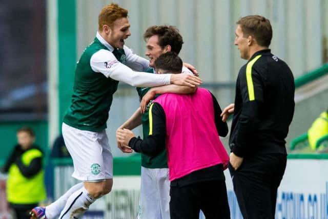 Liam Henderson, centre, celebrates his goal with substitute James Keatings, right, and Fraser Fyvie. Picture: SNS