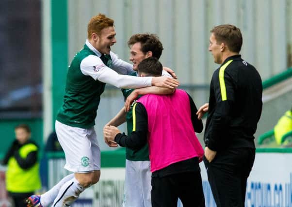 Liam Henderson, centre, celebrates his goal with substitute James Keatings, right, and Fraser Fyvie. Picture: SNS