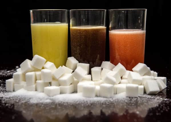Sugar in drinks is associated with the risk of obesity. Picture: PA
