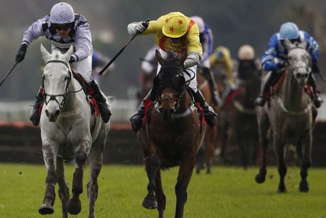 Jockey Jeremiah McGrath and his mount Flugzeug, left, race clear to win at Kempton Park in Sunbury yesterday. Picture: Getty