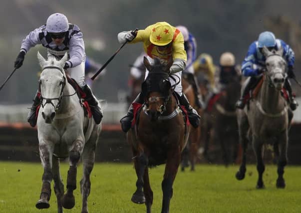 Jockey Jeremiah McGrath and his mount Flugzeug, left, race clear to win at Kempton Park in Sunbury yesterday. Picture: Getty