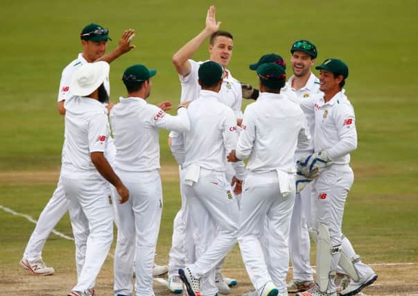 South Africas Morne Morkel, centre, celebrates his caught and bowled to dismiss Alastair Cook. Picture: Getty