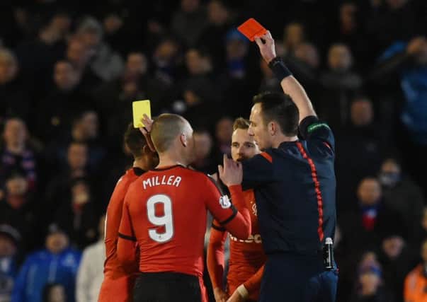 Rangers' Andy Halliday (left) is shown a red card. Picture: SNS