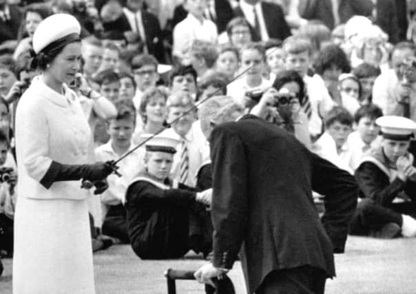 1967: Round-the-world yachtsman Francis Chichester was knighted by the Queen on the quay at Greenwich. Picture: PA