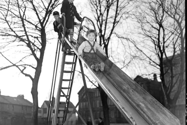 Children playing in Victoria Park Edinburgh - Marjory Fleming goes down chute.