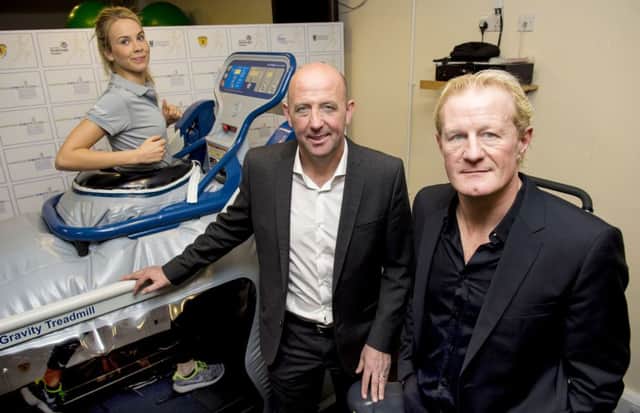 Colin Hendry, right, and Gary McAllister look on as staff demo Hampden sports clinics state of the art anti-gravity treadmill. Picture: SNS