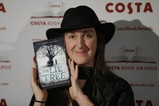 Overall winner Frances Hardinge with her childrens book, The Lie Tree. Picture: AP