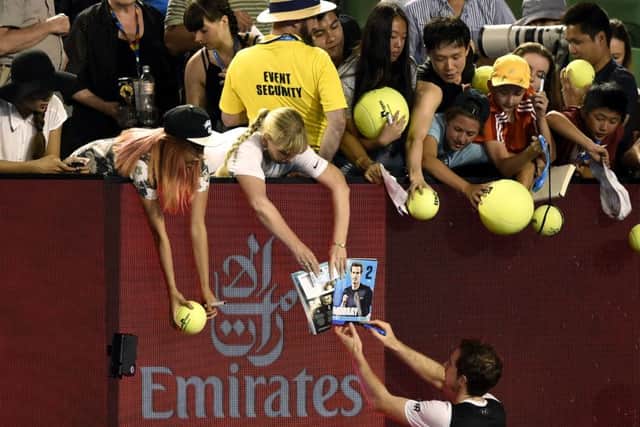 Murray signs autographs for the fans after defeating Ferrer. Picture: AP