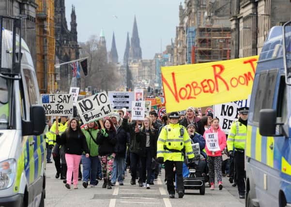 Protesters march from St Andrews Square to the Scottish Parliament at Holyrood.  Picture: Ian Rutherford