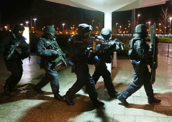 Armed police officers at Intu Braehead, outside Glasgow. Picture: PA