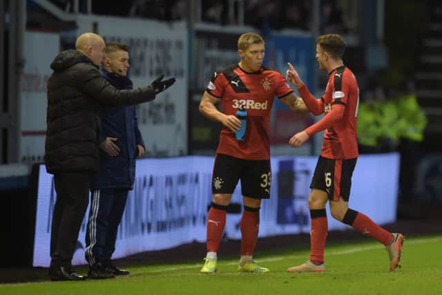 Rangers' Andy Halliday (right) leaves the field after he is shown a red card at Morton. Picture: SNS