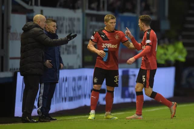 Rangers' Andy Halliday (right) leaves the field after he is shown a red card at Morton. Picture: SNS