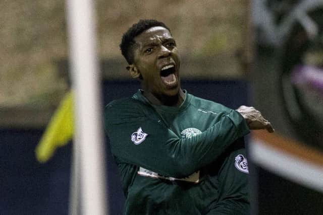 Hibernian's Dominique Malonga (right) celebrates having put his side 1-3 ahead. Picture: SNS
