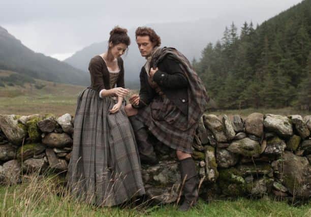 Caitriona Balfe and Sam Heughan playing Claire Randall and Jamie Fraser in Outlander