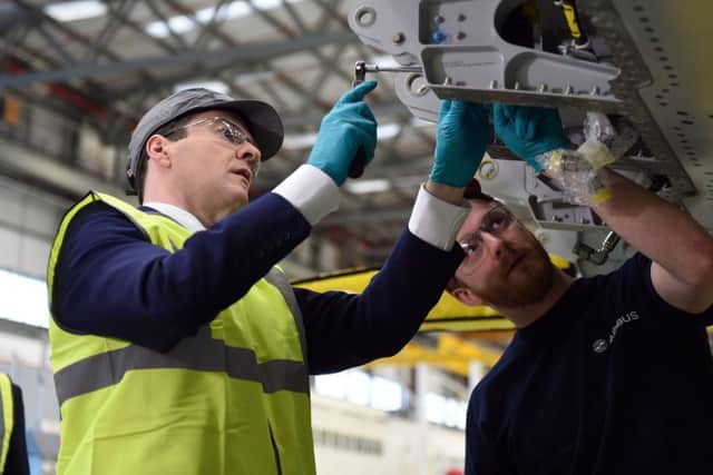 Chancellor George Osborne pulls on his hi-vis jacket again for a visit to the Airbus factory in Bristol yesterday. Picture: PA