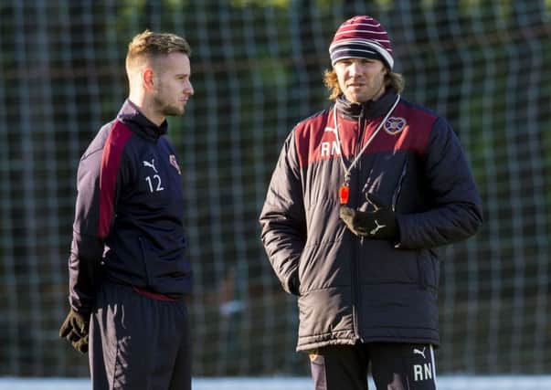 Hearts winger Billy King with head coach Robbie Neilson at training on Thursday. Picture: Craig Foy/SNS