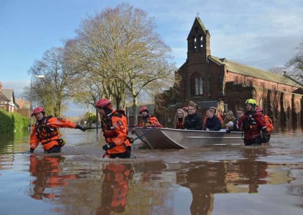 Rescue workers ferried stranded residents to safety in Carlisle. Picture: Getty