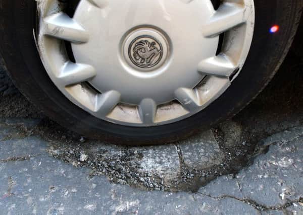 A pothole on the M8 punctured at least four tyres. Neil Hanna