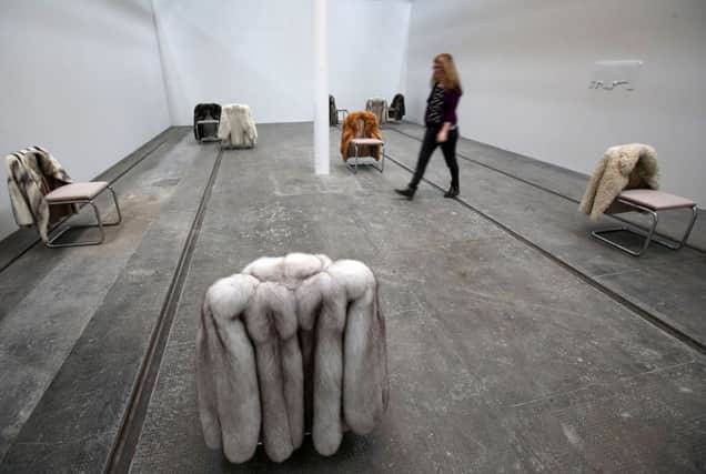 A visitor views an exhibit titled Infrastruktur by Turner Prize 2015 nominee Nicole Wermers. Picture: PA