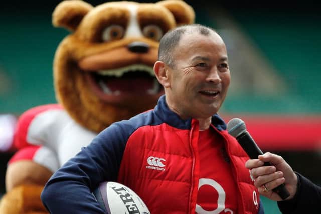 England coach Eddie Jones stands in front of a mascot during a question and answer session at Twickenham. Picture: Adrian Dennis/AFP/Getty Images