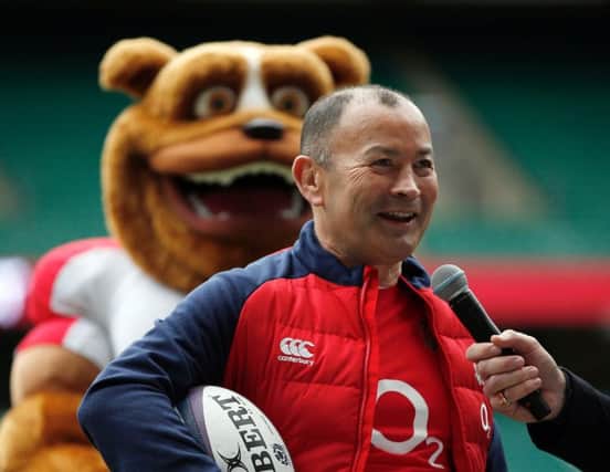 England coach Eddie Jones stands in front of a mascot during a question and answer session at Twickenham. Picture: Adrian Dennis/AFP/Getty Images