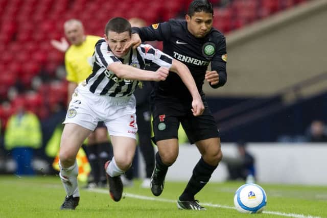 McGinn (left) battles with Emilio Izaguirre during the Buddies' semi-final win over Celtic. Picture: SNS