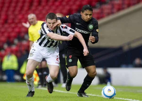 McGinn (left) battles with Emilio Izaguirre during the Buddies' semi-final win over Celtic. Picture: SNS