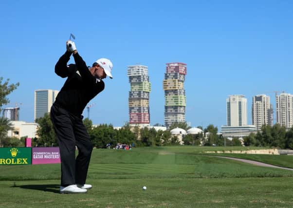 Paul Lawrie plays his tee-shot at the third hole of the Doha Golf Club  on his way to 16 pars and two birdies in his third round. Picture: Getty