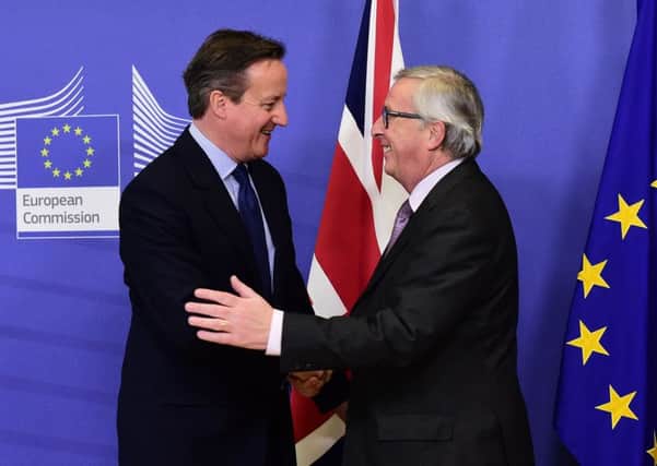 Prime Minister David Cameron with European Commission president Jean-Claude Juncker in Brussels yesterday. Picture: AFP/Getty Images