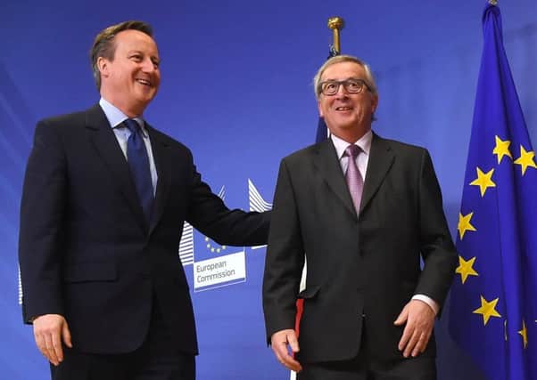 David Cameron is welcomed by European Commission president Jean-Claude Juncker (right) in Brussels. Picture: AFP/Getty Images