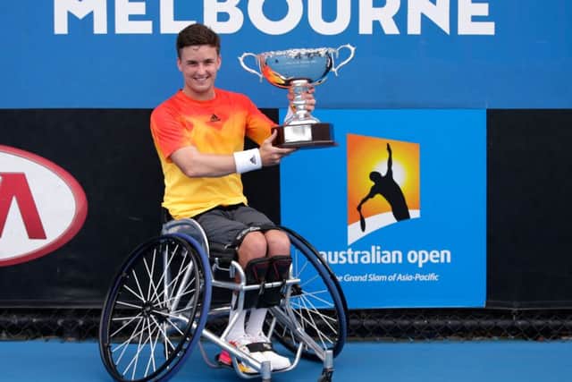 Gordon Reid with the championship trophy after winning the Men's Wheelchair Singles Final. Picture: Getty Images