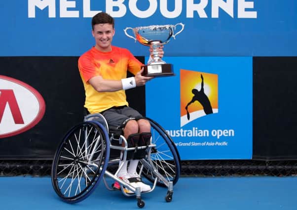 Gordon Reid with the championship trophy after winning the Men's Wheelchair Singles Final. Picture: Getty Images